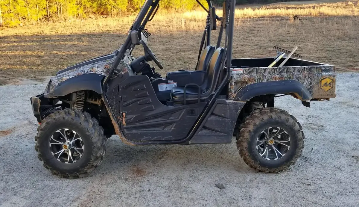 A Massimo 500 is parked on a dirt surface.