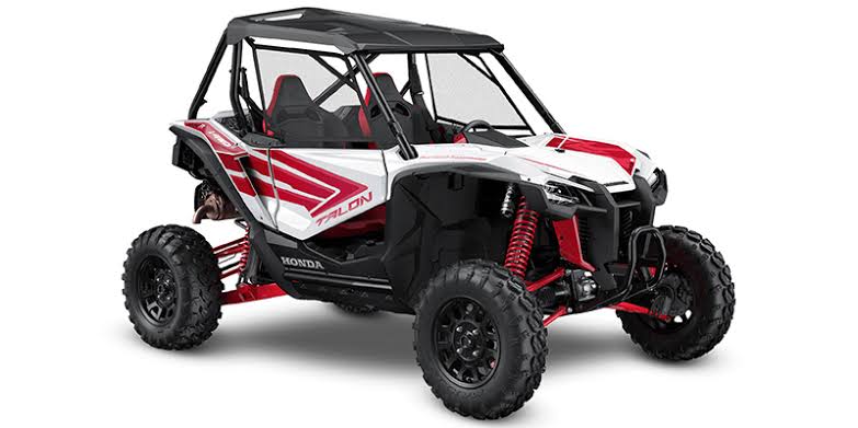 A white and red Honda Talon on a white background.