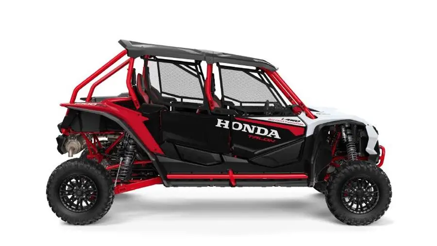 A Black and red Honda Talon on a white background.