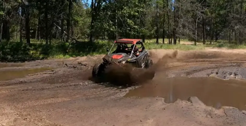 Venturing into the muddy trails of Wisconsin on my Polaris UTV,