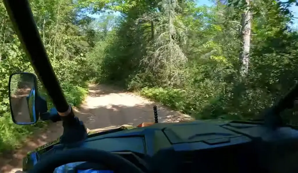 In the driver's seat of my Polaris UTV, I navigated the rolling hills of Wisconsin, realizing the simple joy of an off-road adventure in the heart of nature.