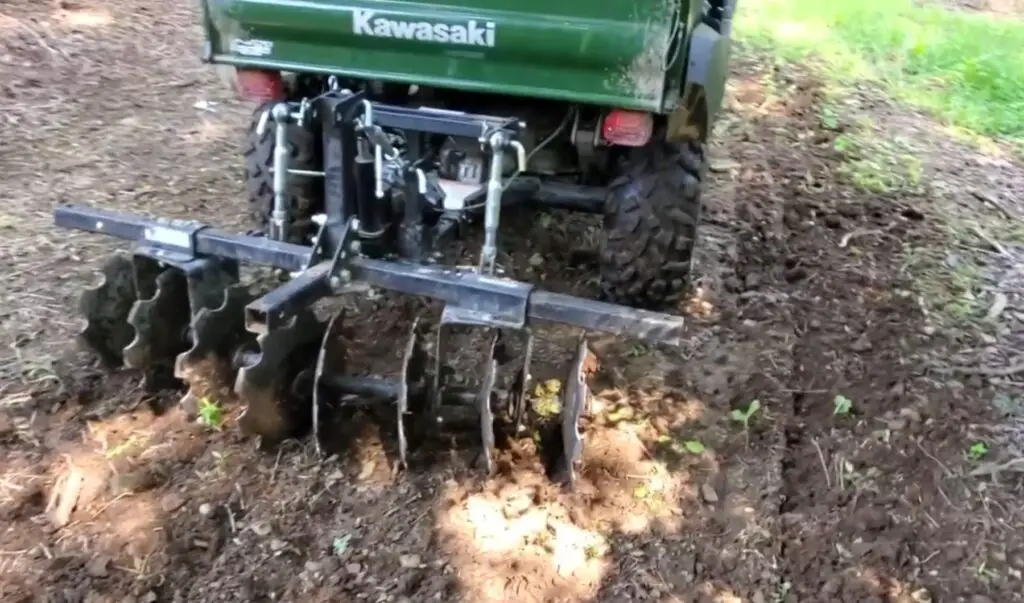 Steering my UTV across the terrain, I joyfully planted seeds with a seed spreader, witnessing the transformation of barren land into a vibrant food plot.