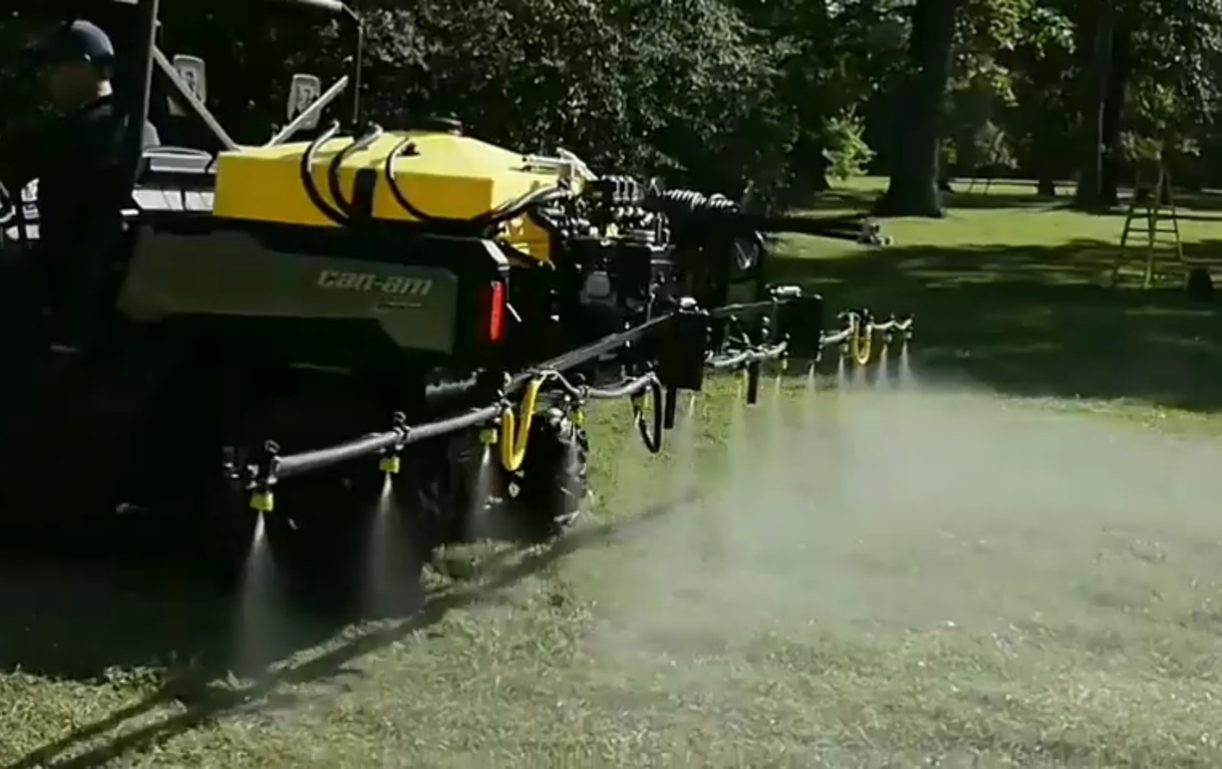 A Can-am UTV with FIMCO 45 Gallon is spraying on a garden field.