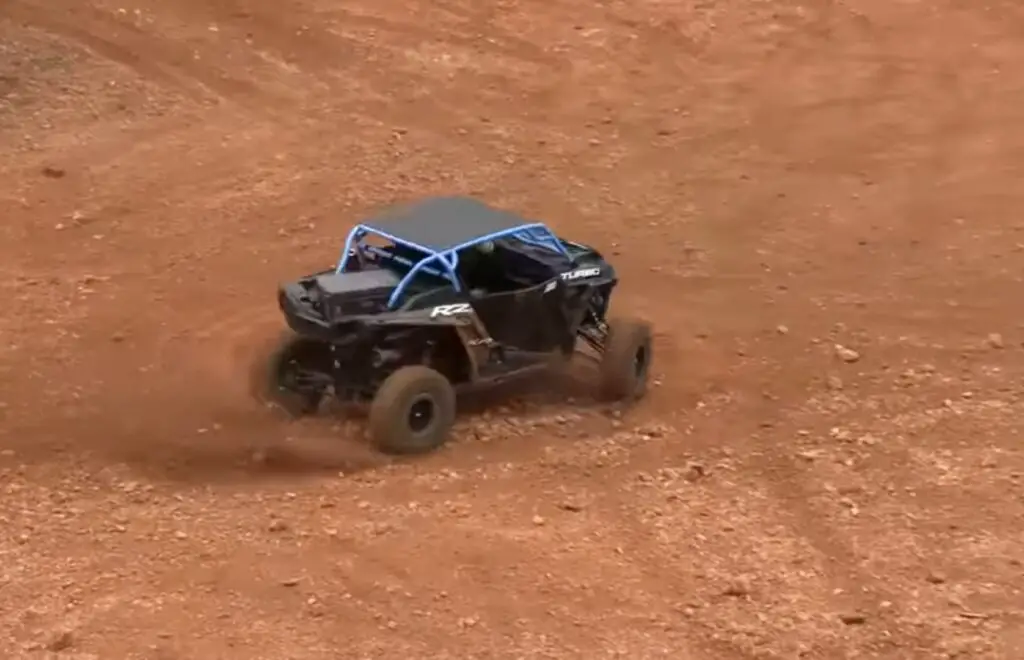 With determination in my eyes, I surged forward, conquering the rugged terrain, the crowd cheering as I blazed a trail to triumph in the UTV hill climb competition.