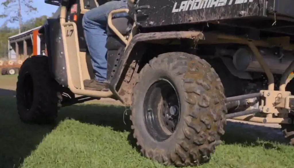 I was driving the American landmaster UTV through a green field.