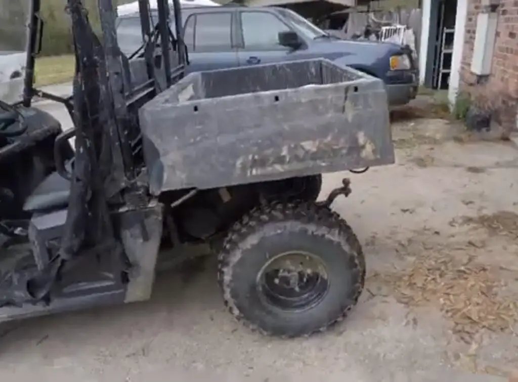 A Polaris Ranger with interco sniper 920 is parked in front of a house.