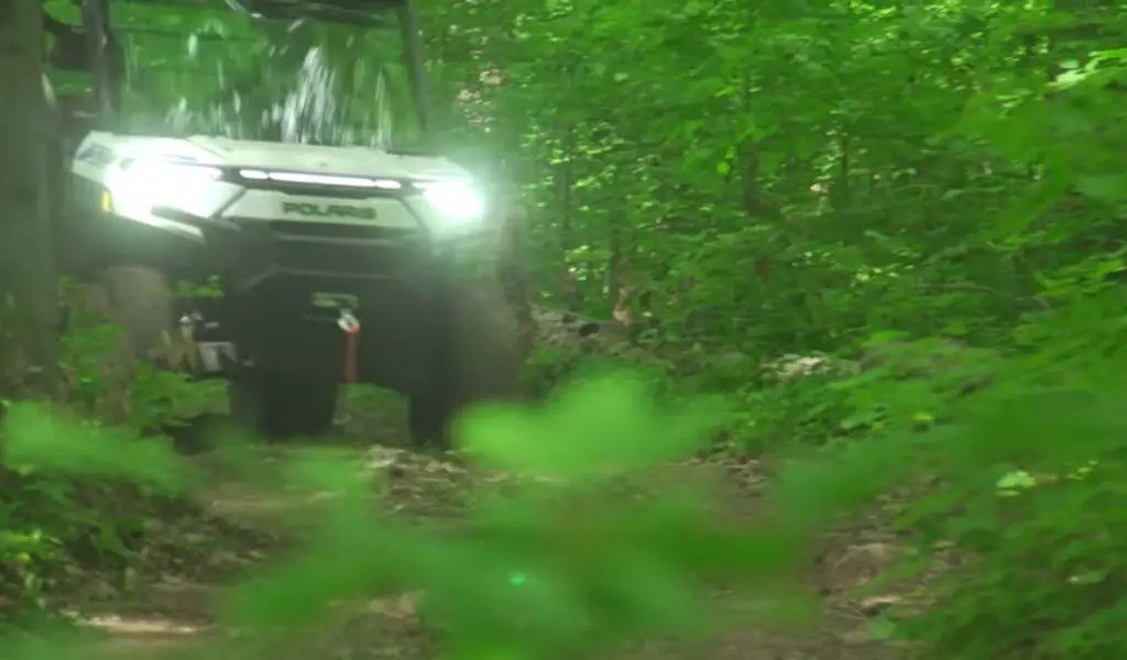 I embarked on a forest adventure with my Polaris Ranger XP Kinetic, weaving through towering trees and navigating rugged terrain, feeling the pulse of nature with every turn.