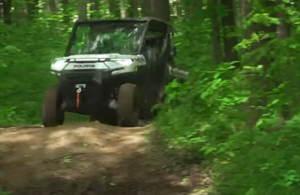 Riding through the forest in my Polaris Ranger XP Kinetic, I felt a sense of exhilaration and freedom, as I embraced the thrill of off-road exploration and the beauty of the natural world.