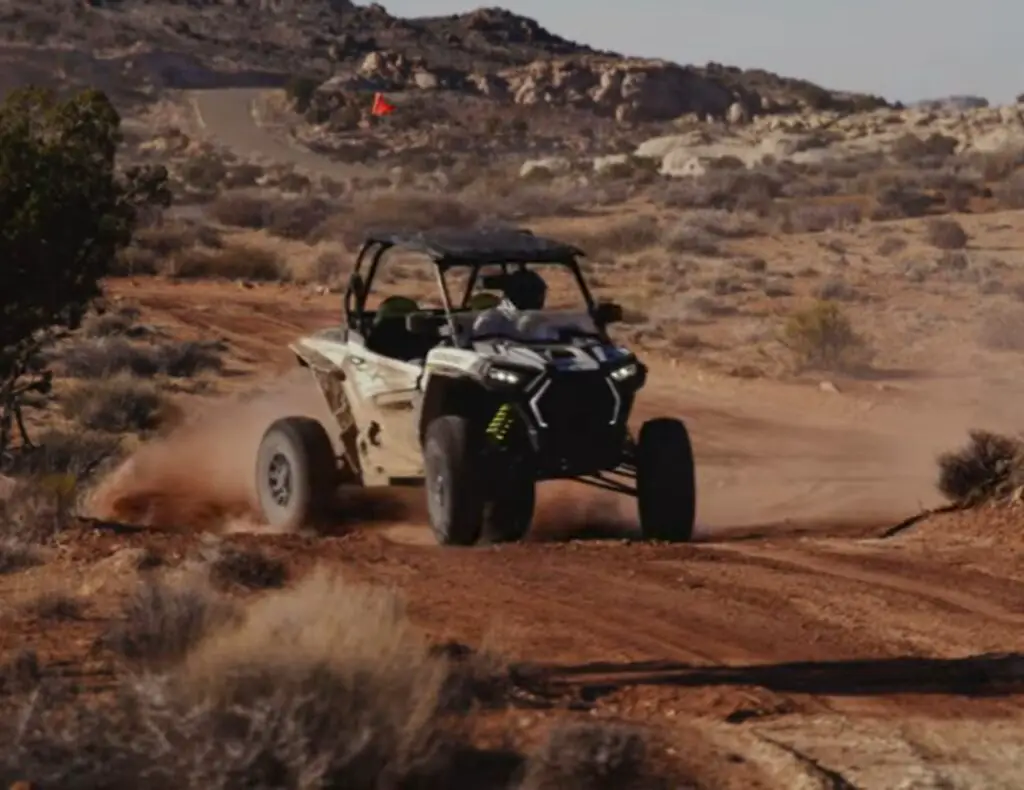 I revved up my Polaris RZR 1000, feeling the rush as I tackled Utah's rugged terrain, kicking up dust behind me.