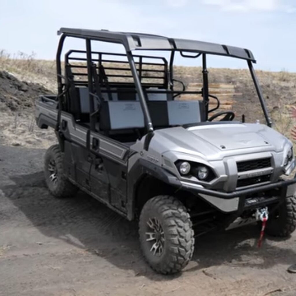 A Kawasaki mule pro FXT is parked on a agriculture land.