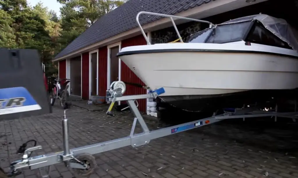 Strapped in and ready to go, I hit the gas on my UTV, towing the boat with ease across the sandy beach.