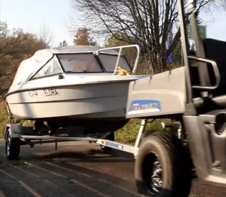 As the sun set over the horizon, I relied on my trusty UTV to tow the boat back home after a long day of adventure.