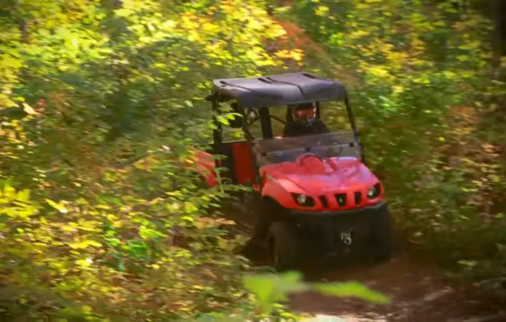 I was driving the Yamaha Rhino 700 through a green jungle.