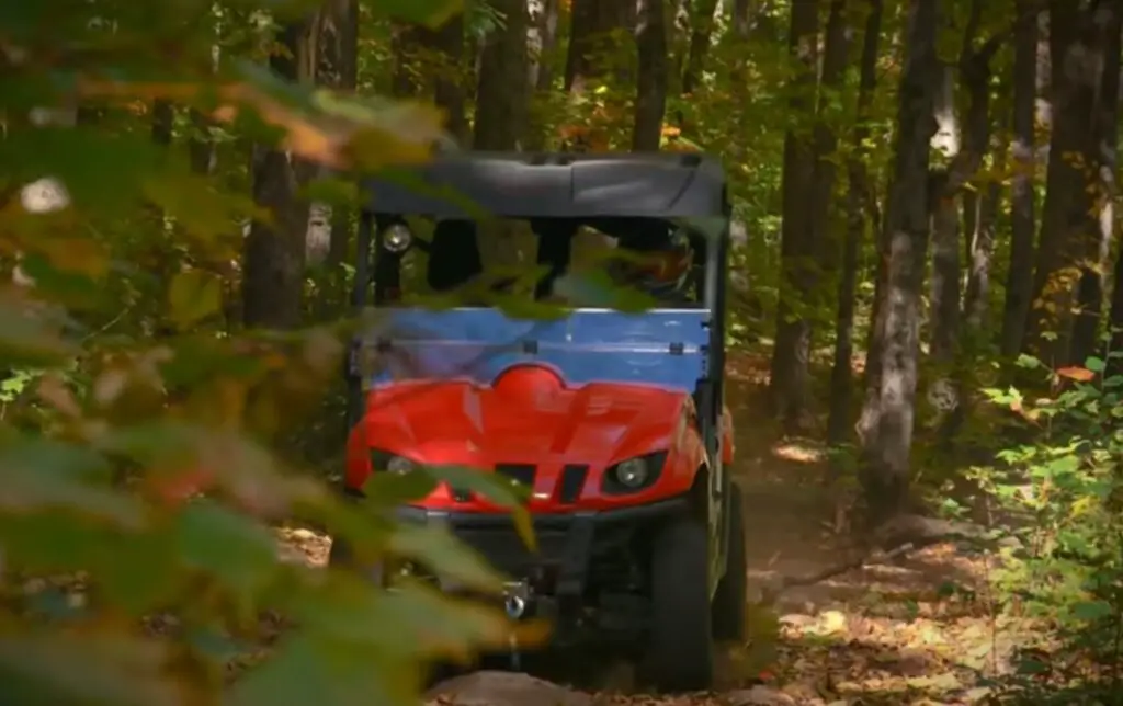 As I delved deeper into the forest's mysteries, the Yamaha Rhino 700 became my trusted ally, its versatile nature and unwavering strength conquering every obstacle in our path.