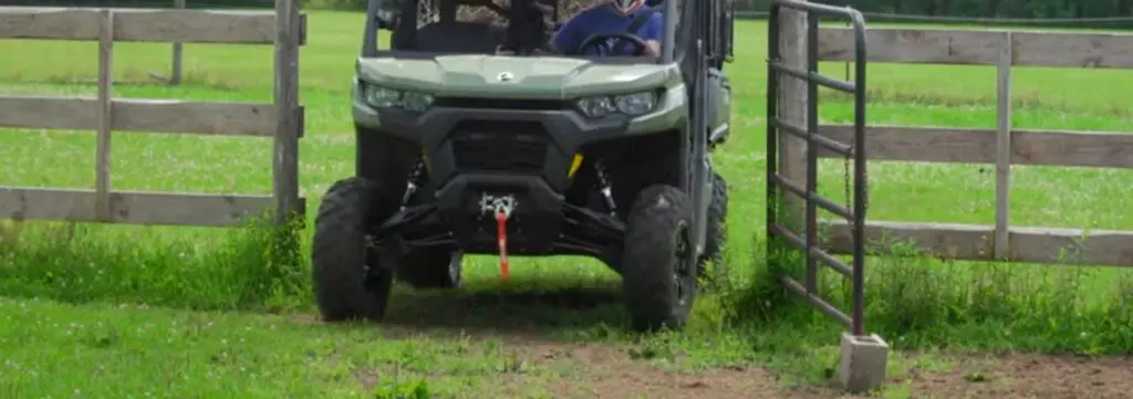 I stayed dry and comfortable in the Can-Am Defender's cab while checking fields during a downpour.