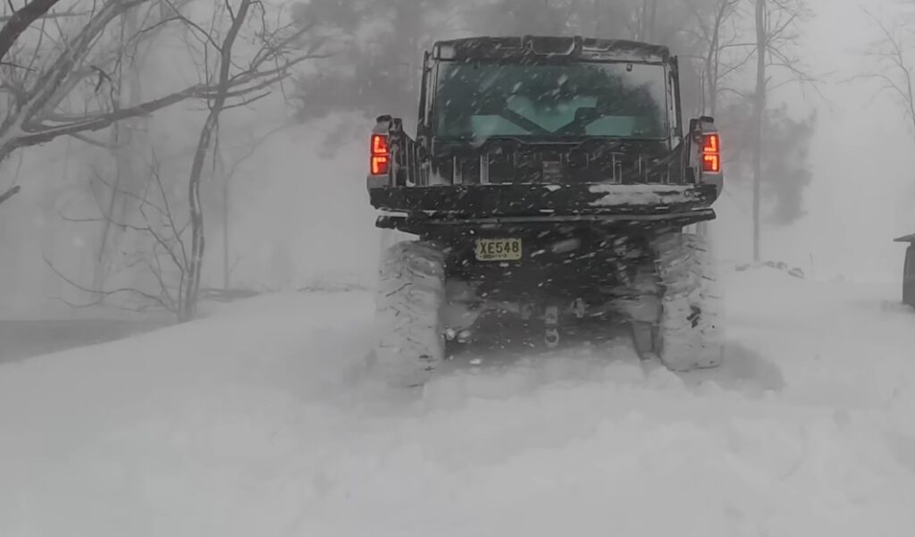 A Polaris Ranger NorthStar is parked on a snow road.