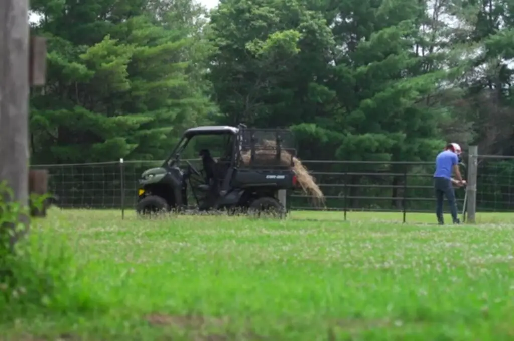 I appreciate the Can-Am Defender UTV's sturdy build when transporting heavy loads of harvested crops.