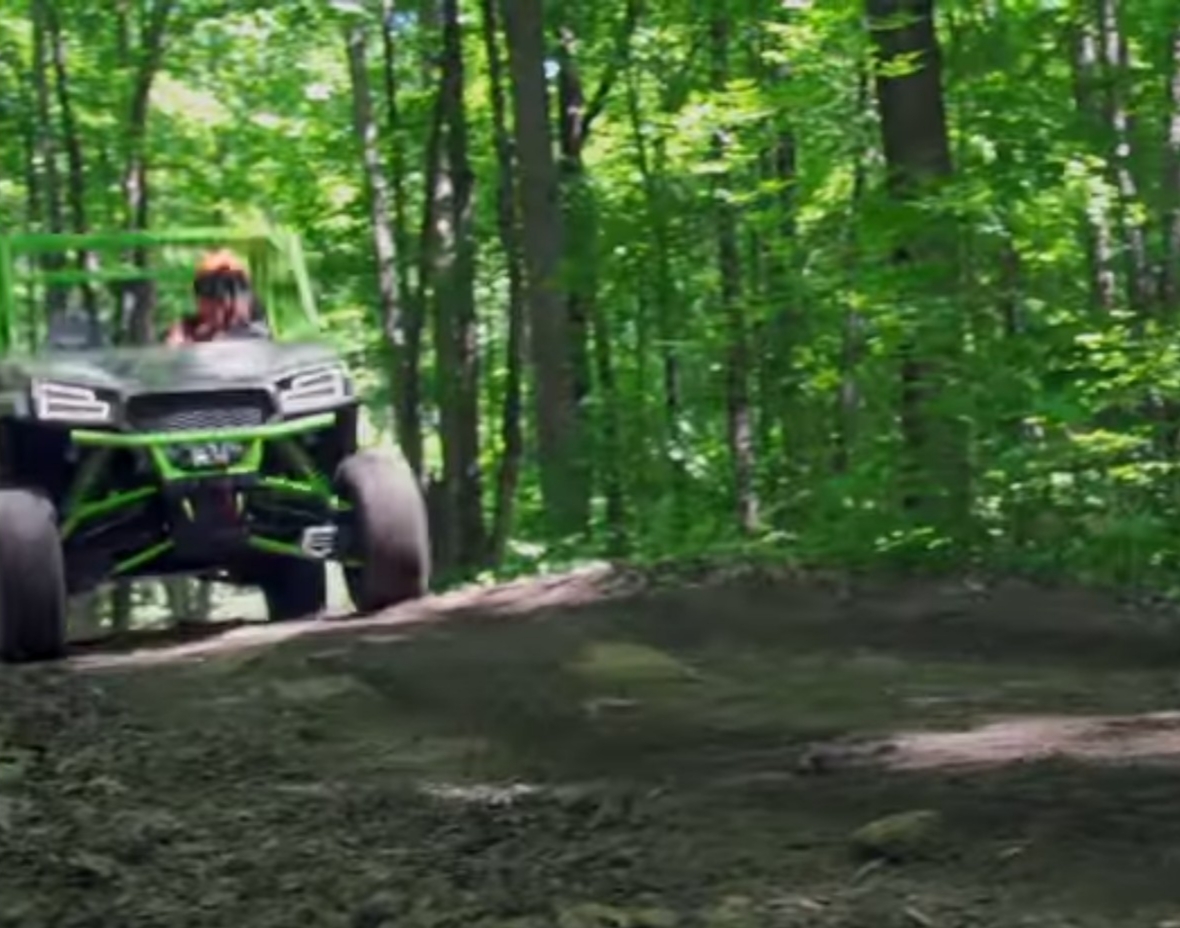 A Textron Havoc X is being driven through a jungle terrain.