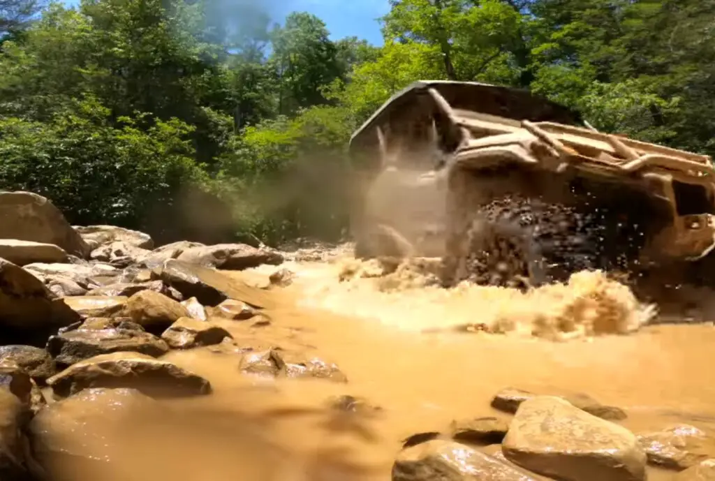 I pushed my Honda Pioneer 1000 to the limit in the muddy backwoods, enjoying the rush of adrenaline with each muddy turn.