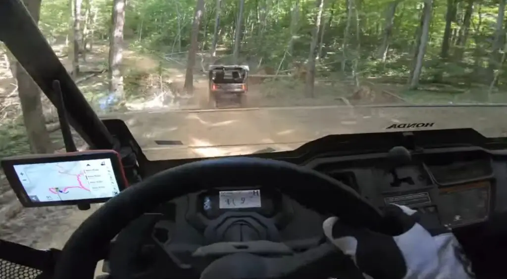 I embraced the challenge of the rough terrain, my Honda Pioneer 1000 performing flawlessly amidst rocks and tree roots.