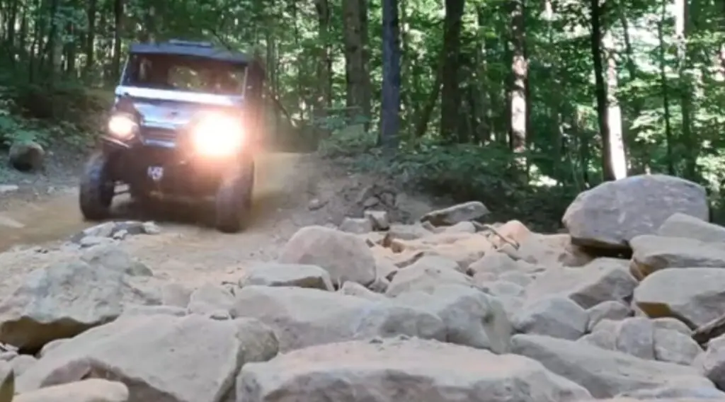 I was driving the Honda Pioneer 1000 through a dirt road.