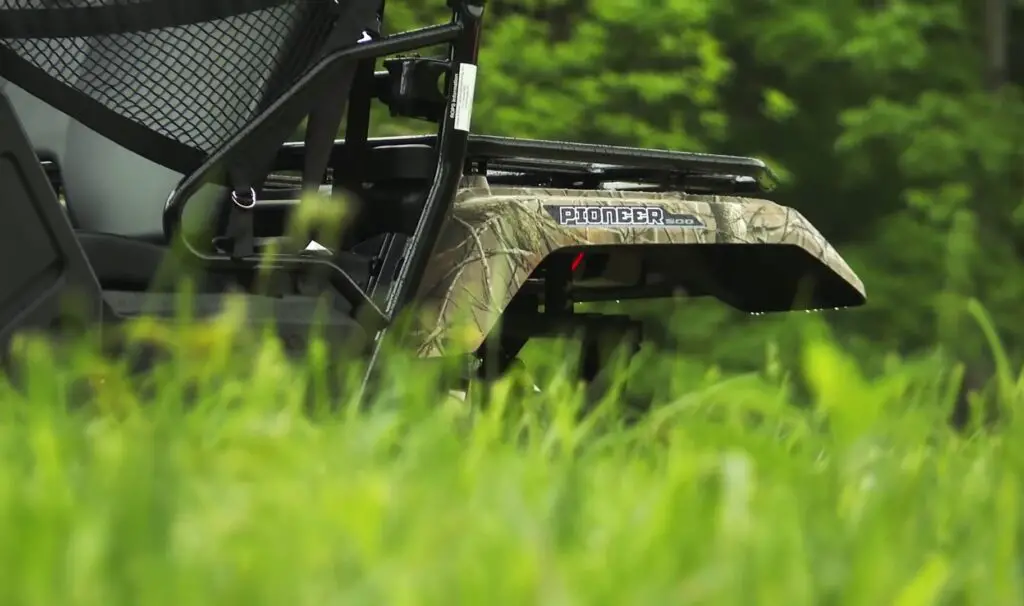 Through fields of green, I rode my Honda Pioneer 500 with joy, the scent of fresh grass filling the air, a free spirit dancing with the wind.