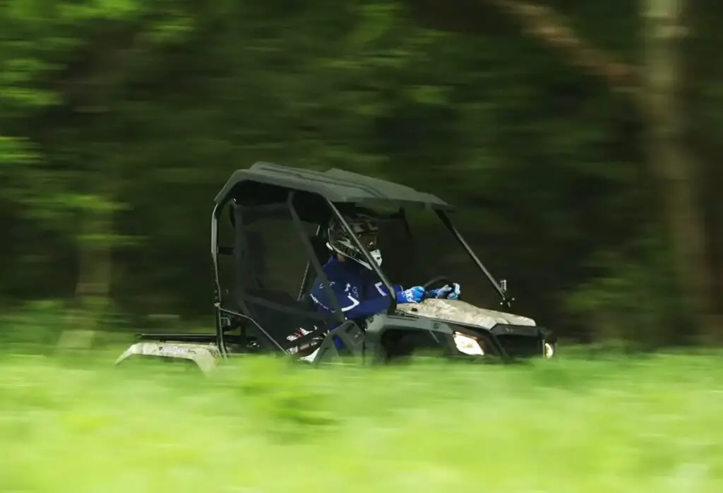 Through the dense foliage, I trusted my Honda Pioneer 500 to lead the way, its headlights piercing the darkness, a fearless explorer carving a path through the wilderness.