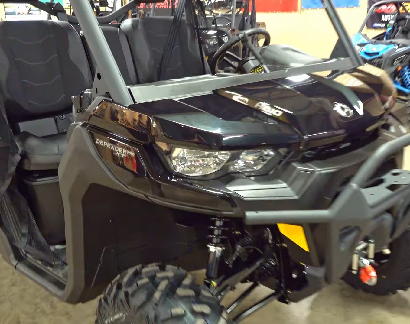 A Can-am defender Pro XT is parked in a garage.