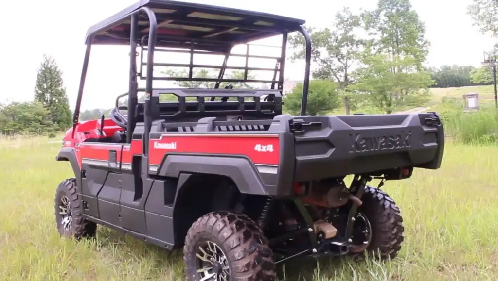 A Kawasaki Mule Pro-FX EPS LE is parked in a grass field.