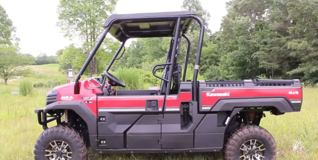 A Kawasaki Mule Pro-FX EPS LE is parked on a grassy field.