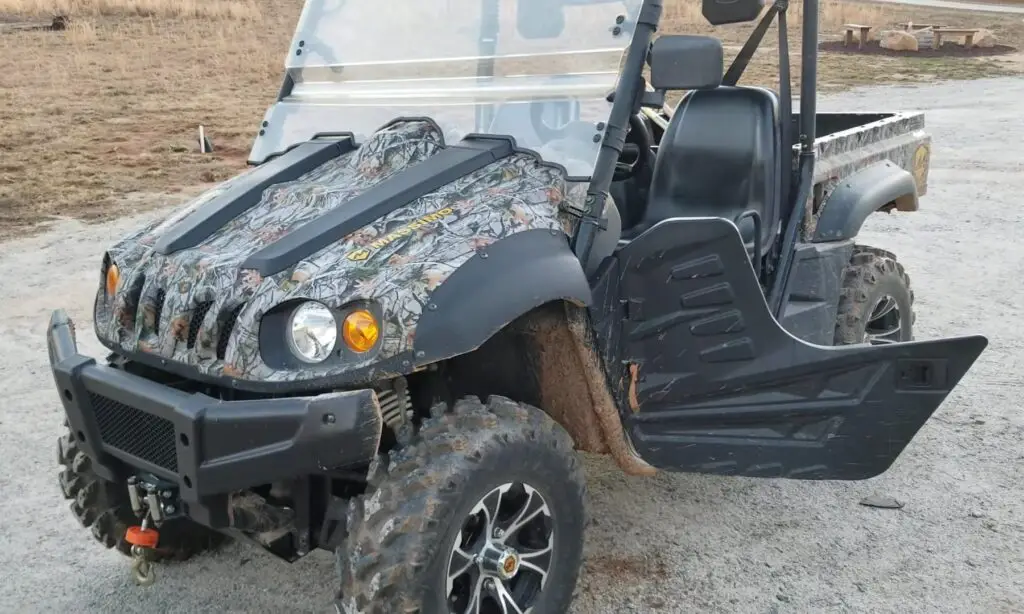 A Massimo 500 with open door is parked on a concrete surface.