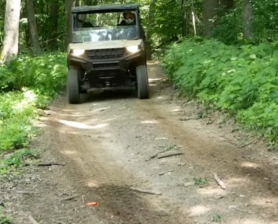 Surrounded by towering trees, I embarked on a forest adventure with my Polaris Ranger 1000 as my guide.