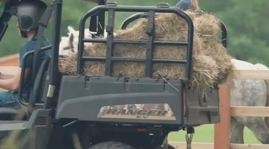 A Polaris Ranger EV with loaded dump bed.