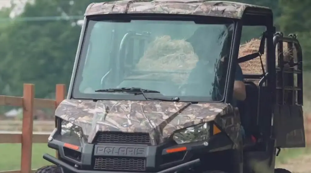 A Polaris Ranger EV with loaded dump bed.