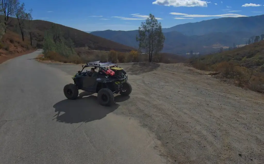 A Polaris UTV is being driven through a road in California.