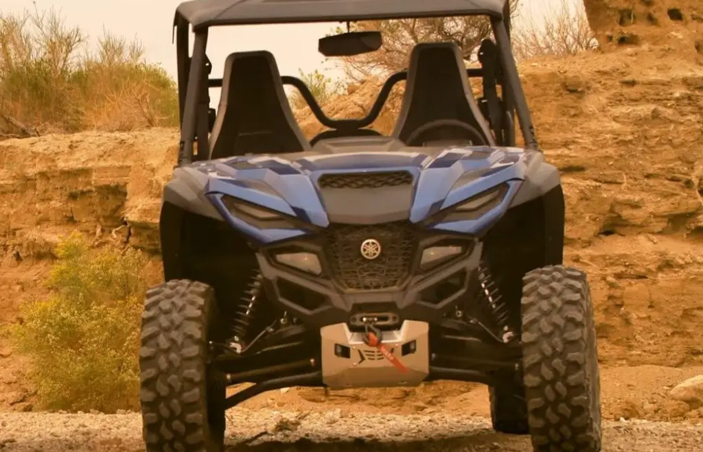 A Yamaha Wolverine RMAX2 is parked on a dirt surface.