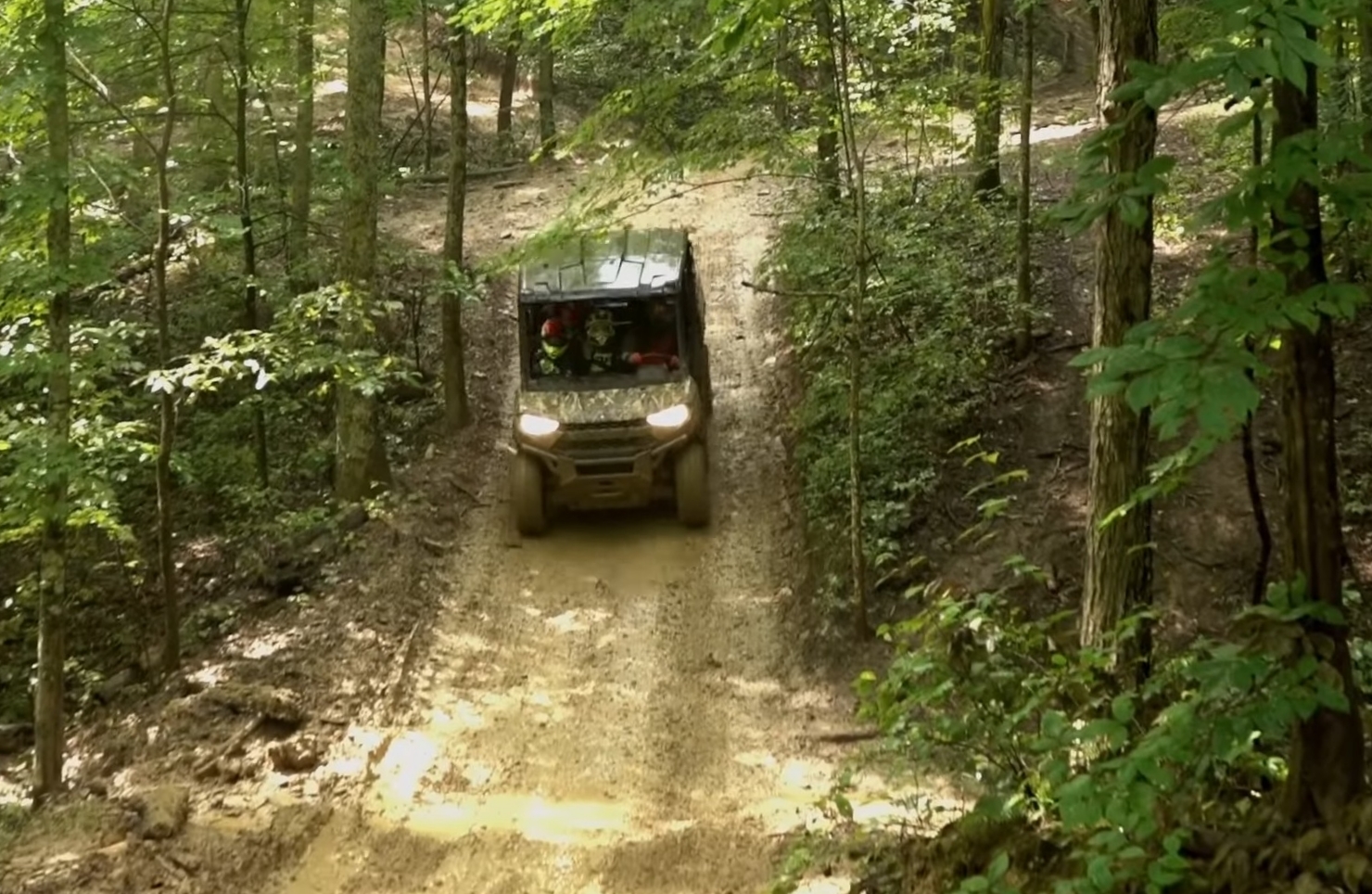 A Polaris Ranger UTV is being driven through a jungle road after fixing UTV Starts then dies problem.