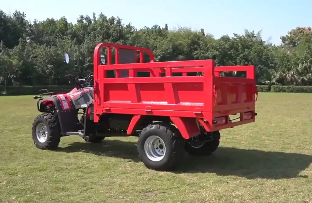 A DIY farming UTV is parked in a green field.