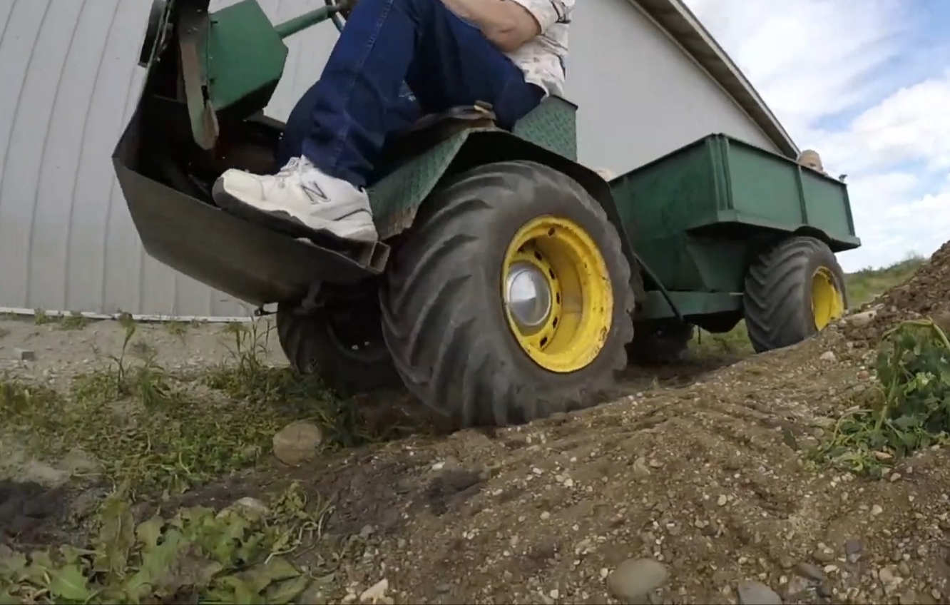 A DIY farm utility vehicle is on a farming field.